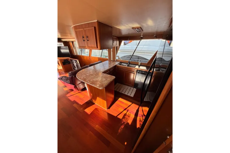 Slide: The Image of Interior of 1984 Hartman-Palmer 60 Flush Deck Motor Yacht with wood finishes and modern amenities. - 19