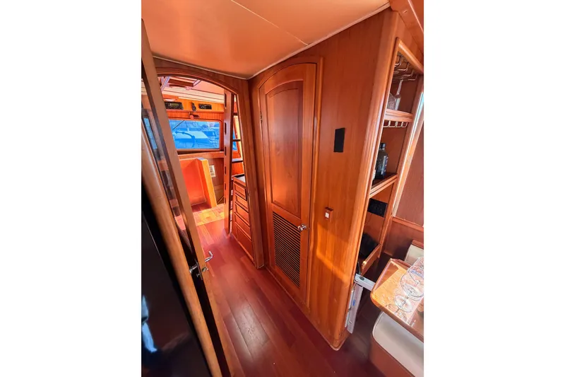 Slide: The Image of Interior of 1984 Hartman-Palmer 60 Flush Deck Motor Yacht with wooden finishes. - 25