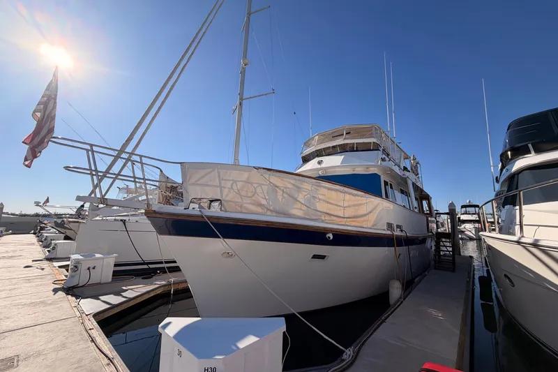 Slide: The Image of 1984 Hartman-Palmer 60 Flush Deck Motor Yacht docked under clear blue sky. - 3