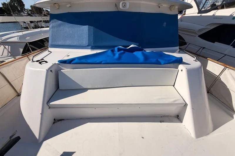 Slide: The Image of 1984 Hartman-Palmer 60 Flush Deck Motor Yacht with blue cover and seating area. - 35