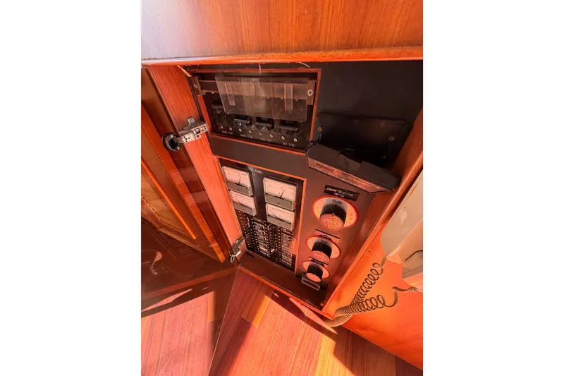 Slide: The Image of Control panel inside 1984 Hartman-Palmer 60 Flush Deck Motor Yacht, featuring switches and gauges. - 43
