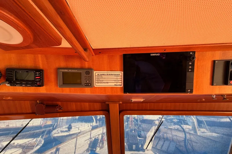 Slide: The Image of Control panel of a 1984 Hartman-Palmer 60 Flush Deck Motor Yacht with navigation equipment. - 45