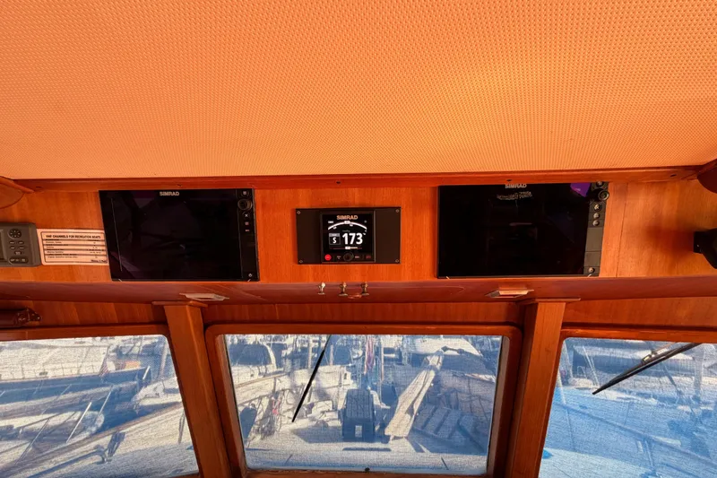 Slide: The Image of Interior helm of 1984 Hartman-Palmer 60 Flush Deck Motor Yacht with navigation equipment. - 46