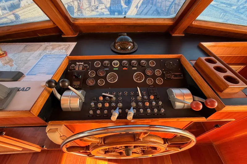 Slide: The Image of Control panel of 1984 Hartman-Palmer 60 Flush Deck Motor Yacht with navigation instruments. - 48