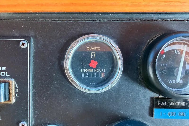 Slide: The Image of Engine hour meter and fuel gauge on 1984 Hartman-Palmer 60 Flush Deck Motor Yacht. - 49