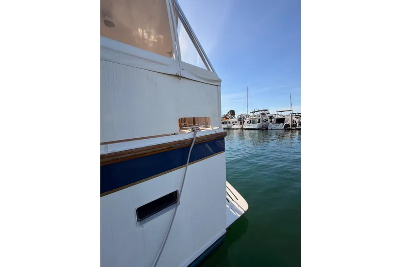 Slide: The Image of 1984 Hartman-Palmer 60 Flush Deck Motor Yacht docked in marina. - 5