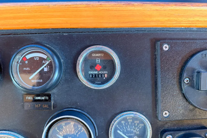 Slide: The Image of Instrument panel of 1984 Hartman-Palmer 60 Flush Deck Motor Yacht showing fuel and engine hours. - 50