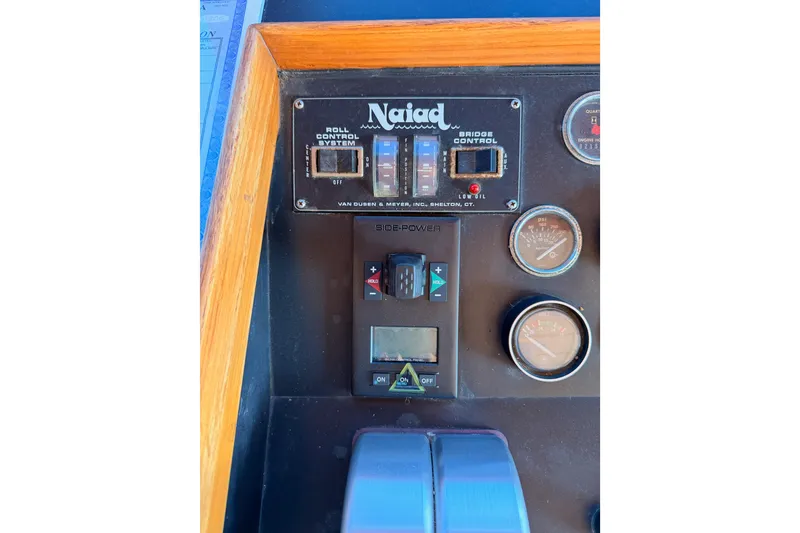 Slide: The Image of Control panel of a 1984 Hartman-Palmer 60 Flush Deck Motor Yacht with gauges and switches. - 51