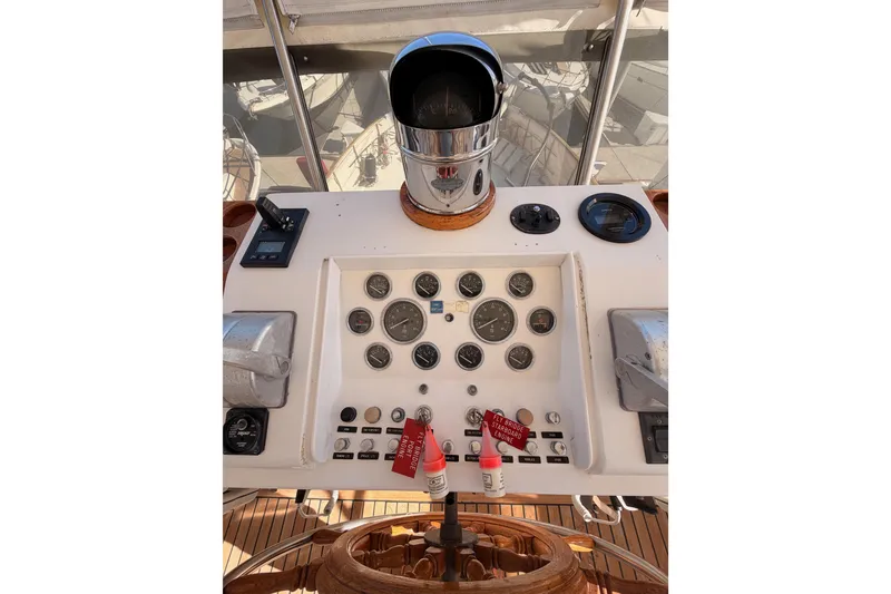 Slide: The Image of Control panel of a 1984 Hartman-Palmer 60 Flush Deck Motor Yacht with gauges and controls. - 65