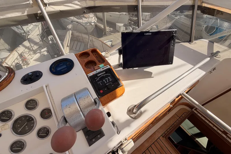 Slide: The Image of Control panel of a 1984 Hartman-Palmer 60 Flush Deck Motor Yacht with navigation equipment. - 67