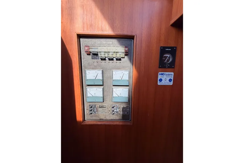 Slide: The Image of Control panel on 1984 Hartman-Palmer 60 Flush Deck Motor Yacht, featuring gauges and switches. - 72