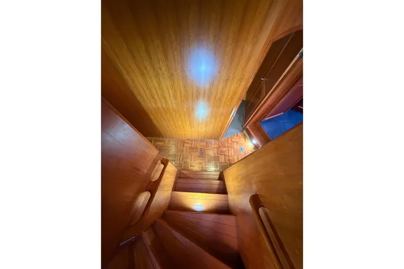 Slide: The Image of Wooden staircase inside 1984 Hartman-Palmer 60 Flush Deck Motor Yacht. - 73