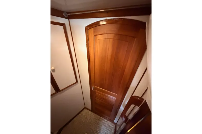 Slide: The Image of Interior view of 1984 Hartman-Palmer 60 Flush Deck Motor Yacht with wooden door. - 86