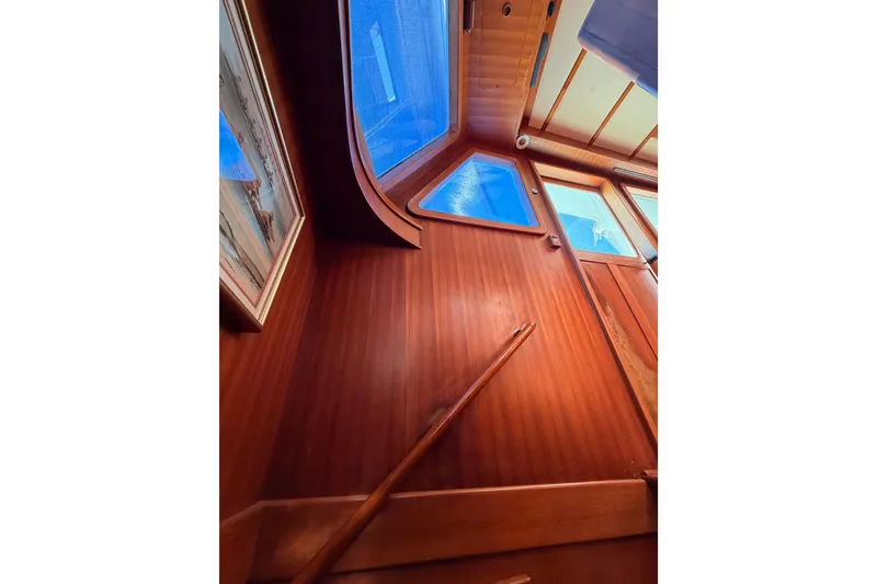 Slide: The Image of Interior view of 1984 Hartman-Palmer 60 Flush Deck Motor Yacht with wooden paneling and windows. - 88