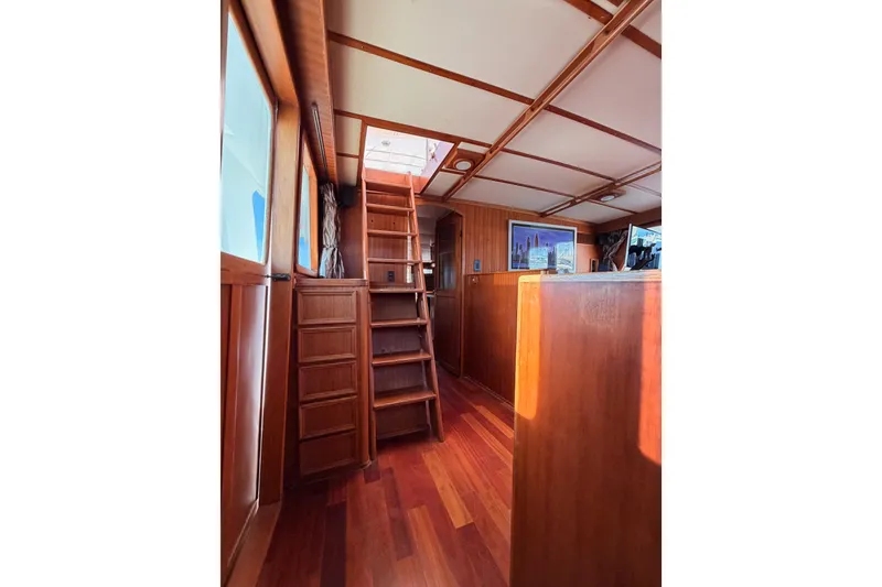 Slide: The Image of Interior of 1984 Hartman-Palmer 60 Flush Deck Motor Yacht with wooden stairs and paneling. - 89