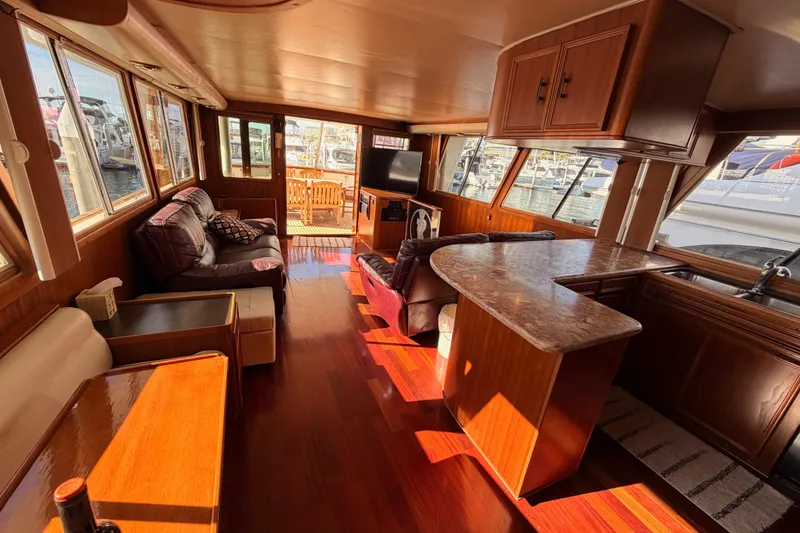 Slide: The Image of Luxurious 1984 Hartman-Palmer 60 Flush Deck Motor Yacht interior with elegant wood finishes. - 92