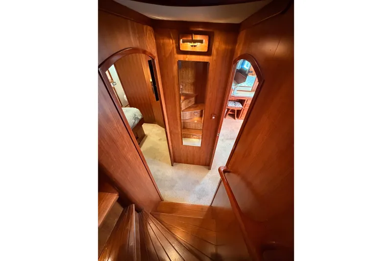 Slide: The Image of 1984 Hartman-Palmer 60 Flush Deck Motor Yacht interior with wooden finishes and carpeted flooring. - 96