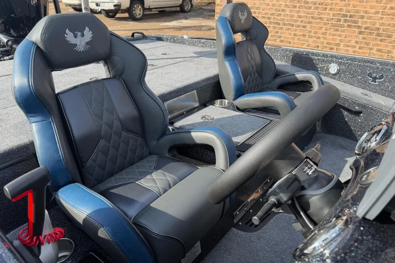 Slide: The Image of 2026 Phoenix 921 Elite X boat interior with luxury seating and steering wheel. - 10