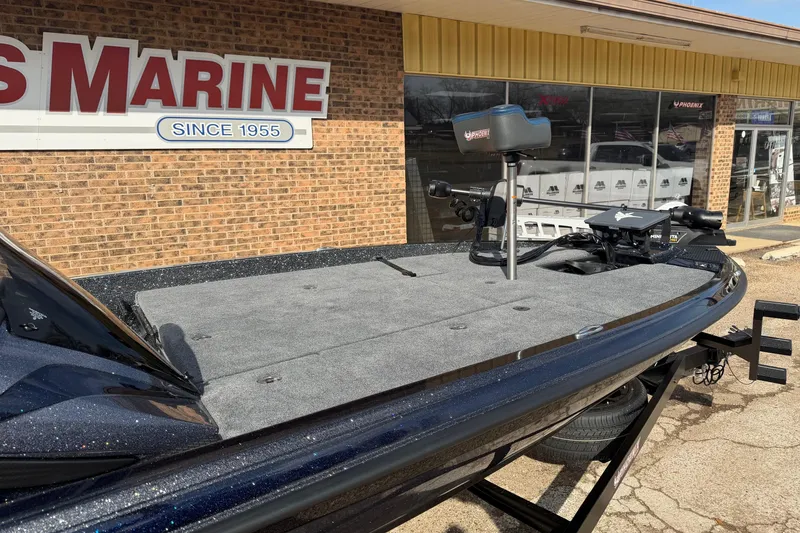 Slide: The Image of 2026 Phoenix 921 Elite X boat displayed outside a marine store. - 4