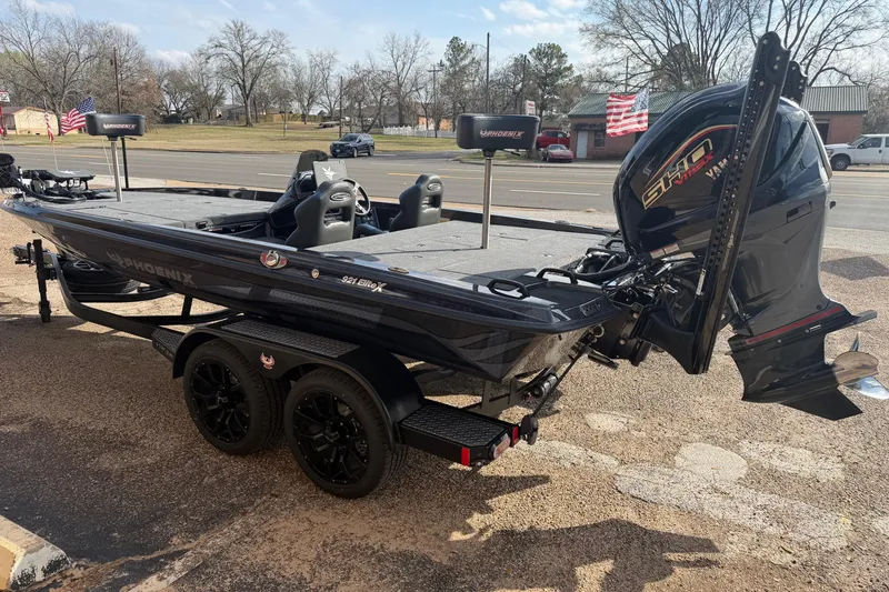 Slide: The Image of 2026 Phoenix 921 Elite X boat with powerful engine, parked on a trailer. - 5