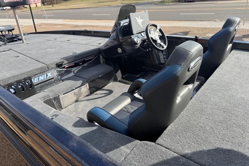 Slide: The Image of 2026 Phoenix 921 Elite X boat interior with dual seats and steering console. - 6