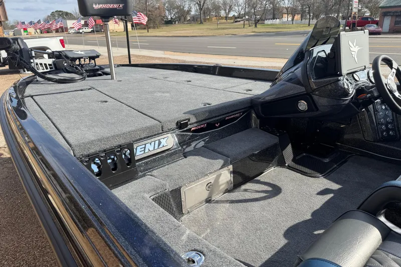 Slide: The Image of 2026 Phoenix 921 Elite X boat interior with advanced dashboard and spacious deck. - 8