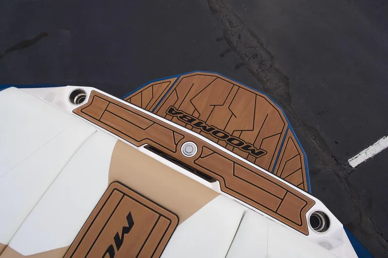 Slide: The Image of 2024 Moomba Max boat with stylish deck design and logo detailing. - 11
