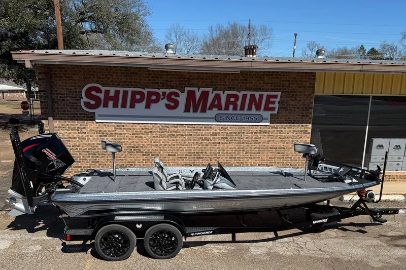 Slide: The Image of Phoenix 921 Elite X 2026 in front of Shipp's Marine building. - 1