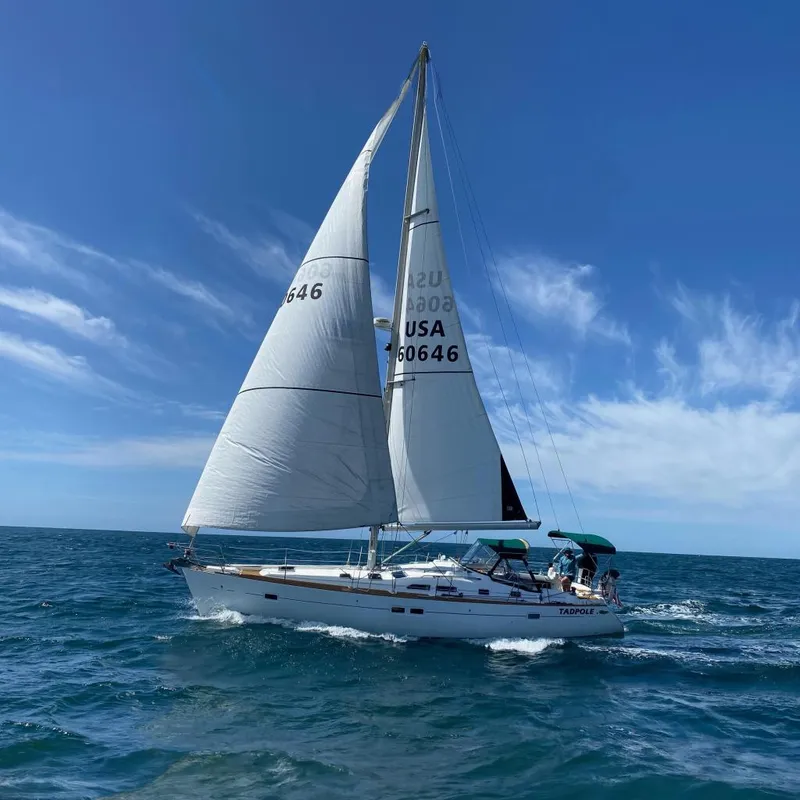 Slide: The Image of 2005 Beneteau Oceanis Clipper 423 sailboat on open sea. - 0