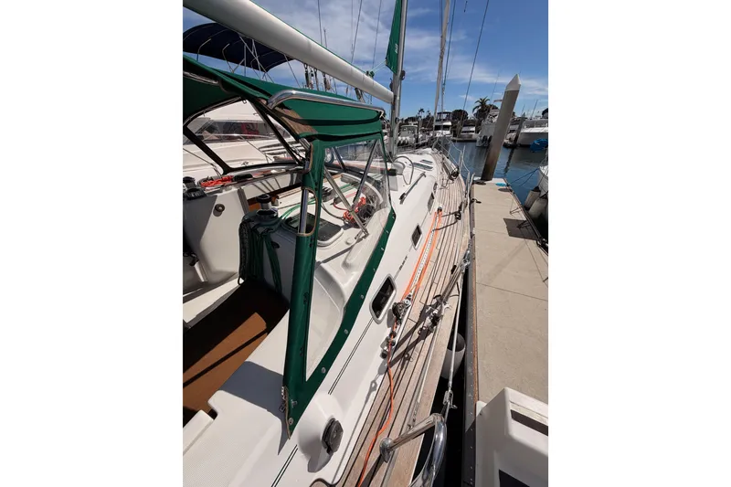 Slide: The Image of 2005 Beneteau Oceanis Clipper 423 sailboat docked at marina, side view. - 17