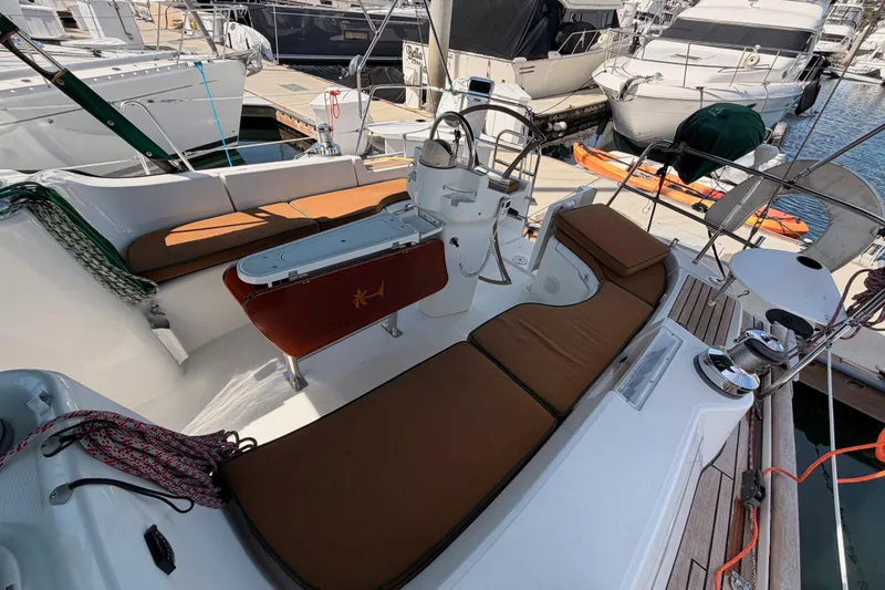 Slide: The Image of 2005 Beneteau Oceanis Clipper 423 yacht cockpit with brown cushions, docked in marina. - 30