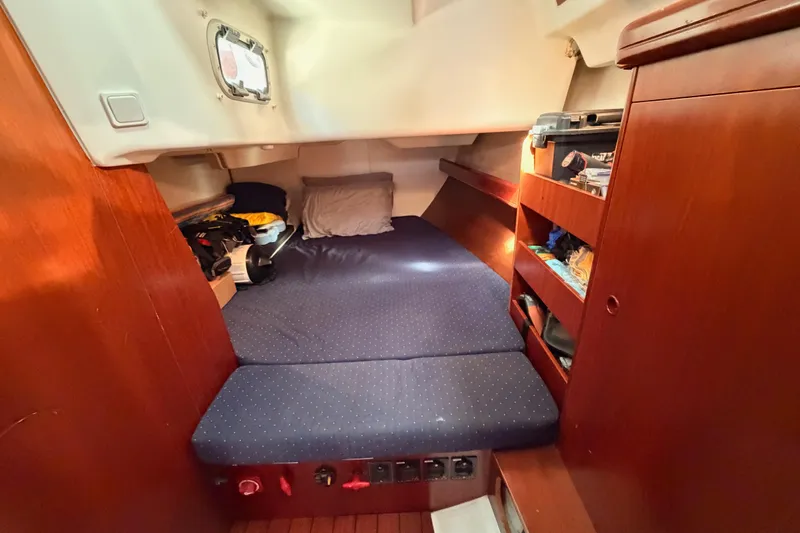 Slide: The Image of Cozy cabin interior of 2005 Beneteau Oceanis Clipper 423 sailboat with storage shelves. - 49