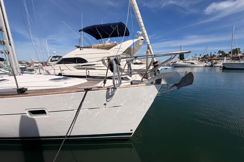 Slide: The Image of 2005 Beneteau Oceanis Clipper 423 yacht docked in a marina under a clear blue sky. - 6