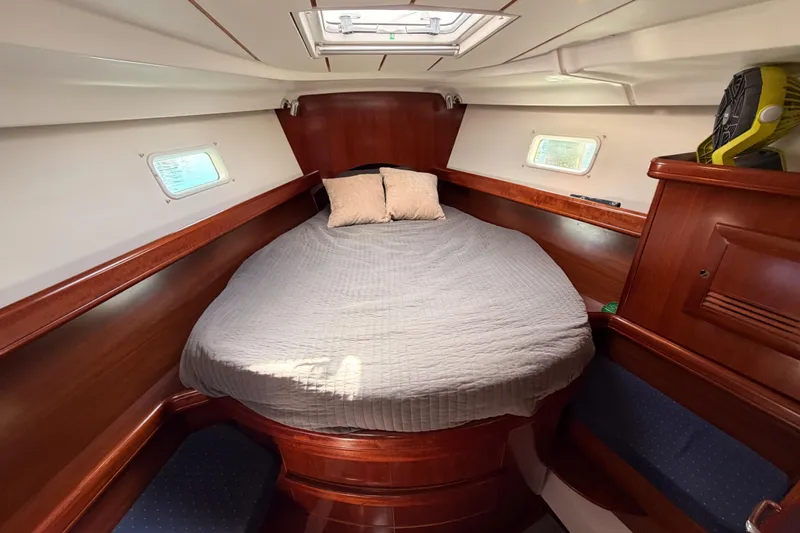 Slide: The Image of Cozy cabin interior of 2005 Beneteau Oceanis Clipper 423 sailboat with double bed. - 60