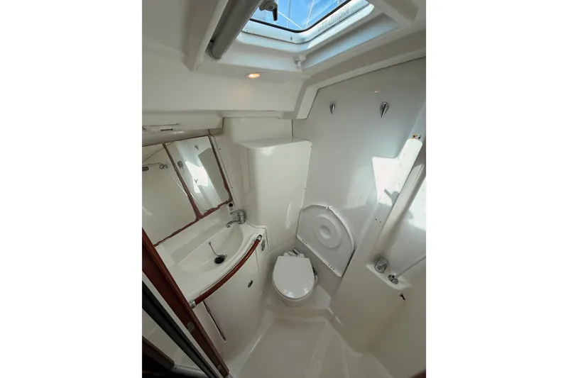 Slide: The Image of Bathroom interior of 2005 Beneteau Oceanis Clipper 423 yacht, featuring sink and toilet. - 62