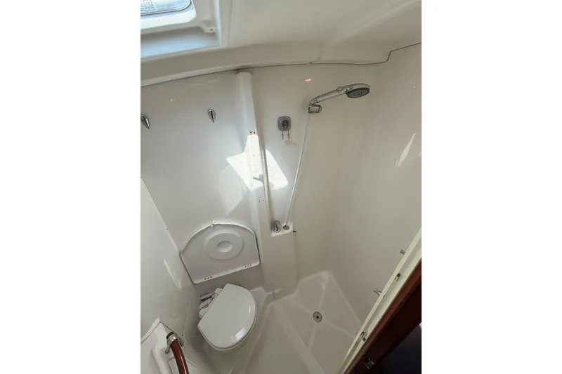 Slide: The Image of Bathroom interior of 2005 Beneteau Oceanis Clipper 423 yacht, featuring shower and toilet. - 63
