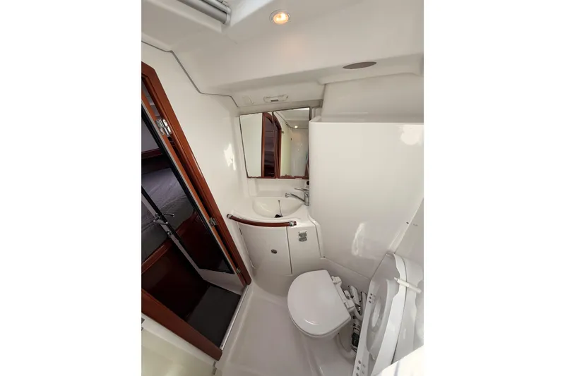 Slide: The Image of Bathroom interior of 2005 Beneteau Oceanis Clipper 423 yacht, featuring sink and toilet. - 65