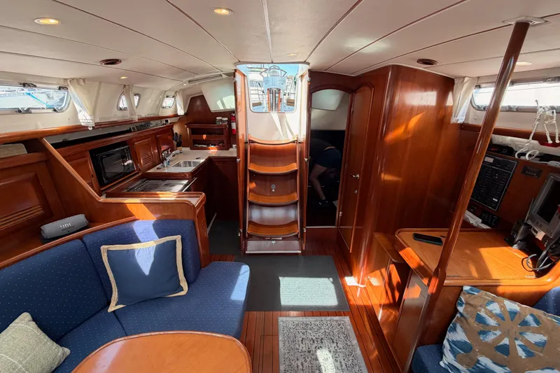 Slide: The Image of Interior of 2005 Beneteau Oceanis Clipper 423 yacht with wood finish and cozy seating. - 71