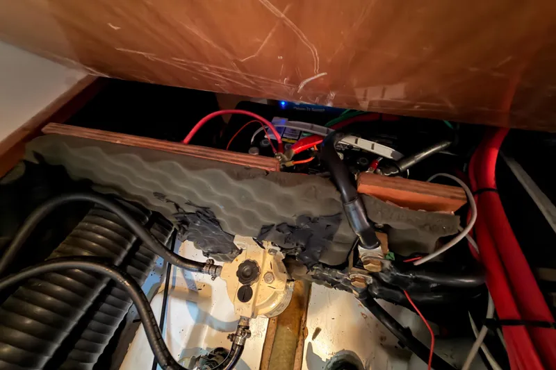 Slide: The Image of Engine compartment of 2005 Beneteau Oceanis Clipper 423 with visible wiring and components. - 74