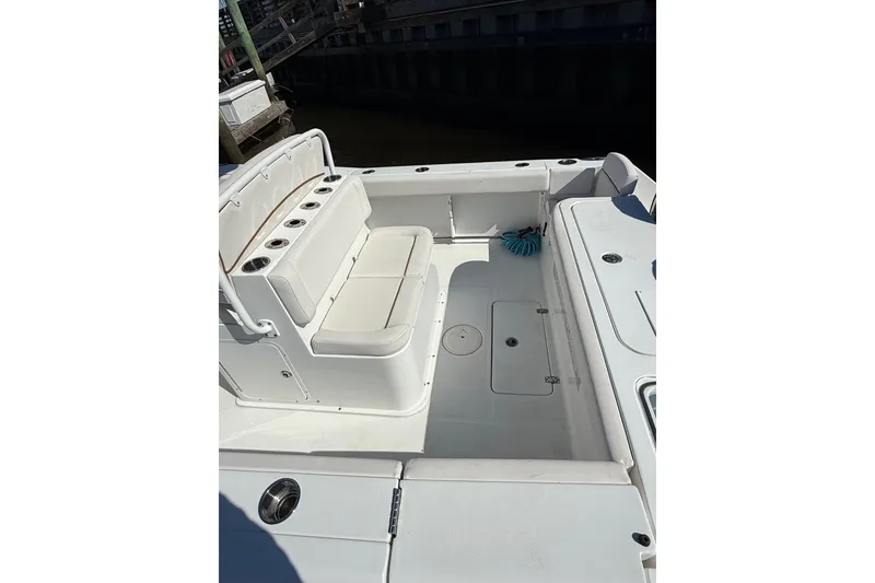 Slide: The Image of 2020 Sea Hunt Gamefish 27 boat interior with seating and storage compartments. - 11