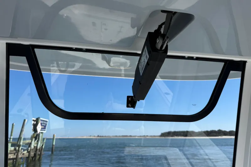 Slide: The Image of 2020 Sea Hunt Gamefish 27 window view overlooking calm waters and dock. - 16