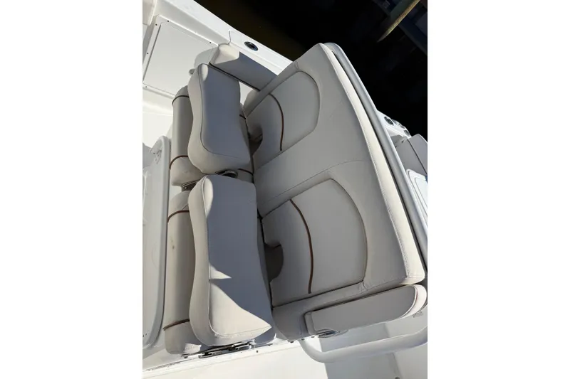 Slide: The Image of 2020 Sea Hunt Gamefish 27 boat seating, featuring comfortable, cushioned design in light upholstery. - 6