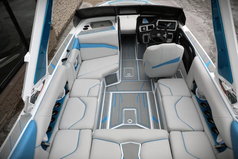 Slide: The Image of 2026 Centurion Nv233 boat interior with modern seating and sleek design. - 13
