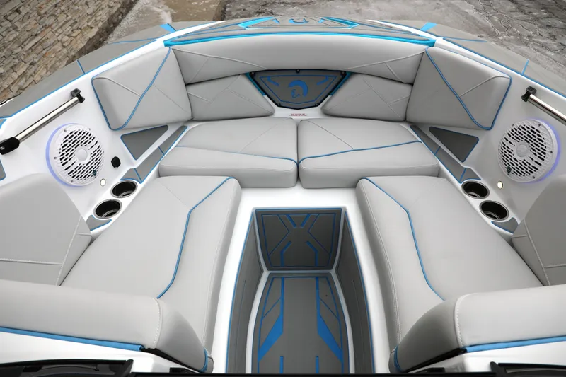 Slide: The Image of Luxurious interior of 2026 Centurion Nv233 boat with sleek gray seating and blue accents. - 14