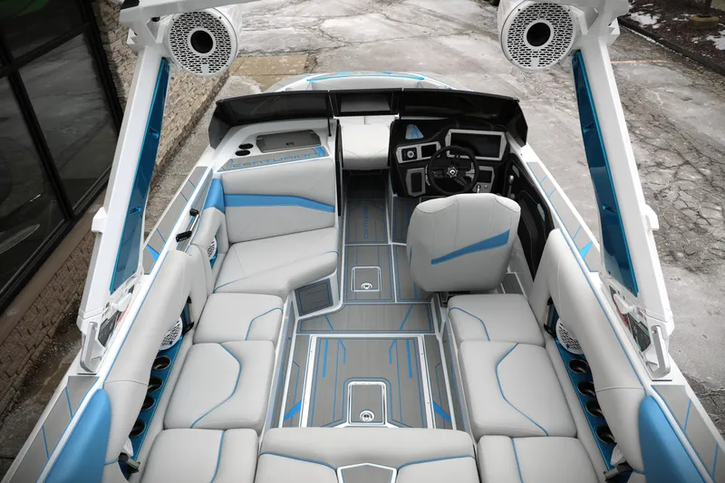 Slide: The Image of 2026 Centurion Nv233 boat interior with modern seating and advanced dashboard features. - 21