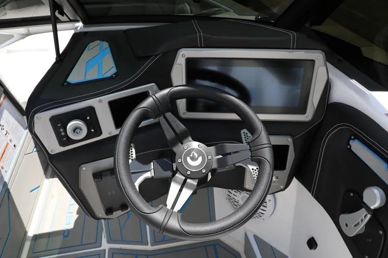 Slide: The Image of Steering wheel and dashboard of 2026 Centurion Nv233 boat, featuring modern controls and touchscreen. - 8
