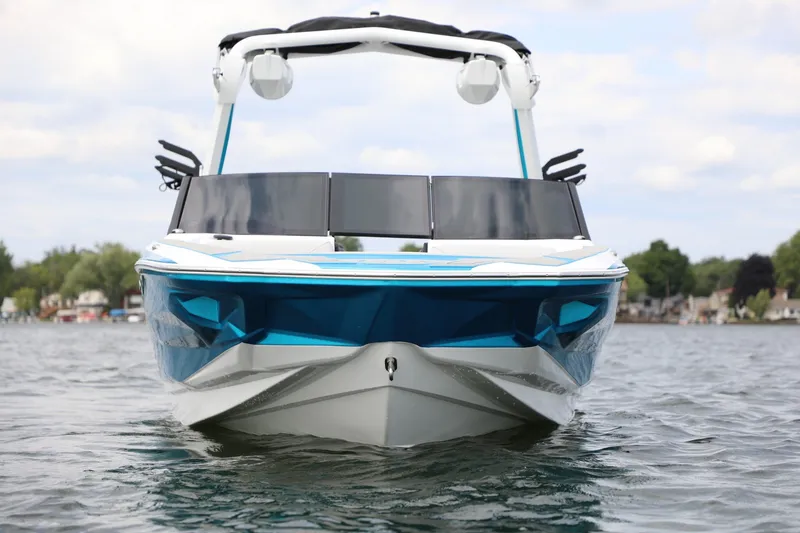 Slide: The Image of Front view of a 2026 Centurion Nv233 boat on a lake. - 5