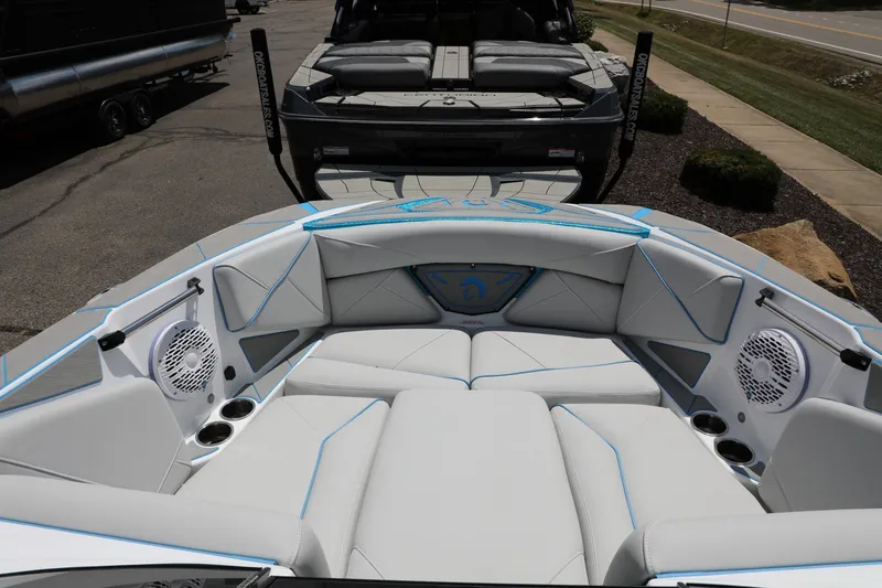 Slide: The Image of Luxurious interior of 2026 Centurion Nv233 boat with white seating and speakers. - 10