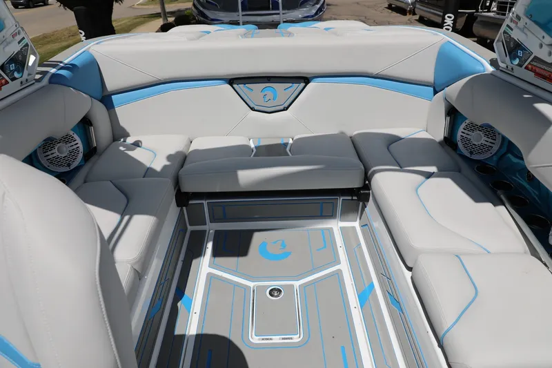 Slide: The Image of Luxurious interior of 2026 Centurion Nv233 boat with blue and gray seating and modern design. - 9