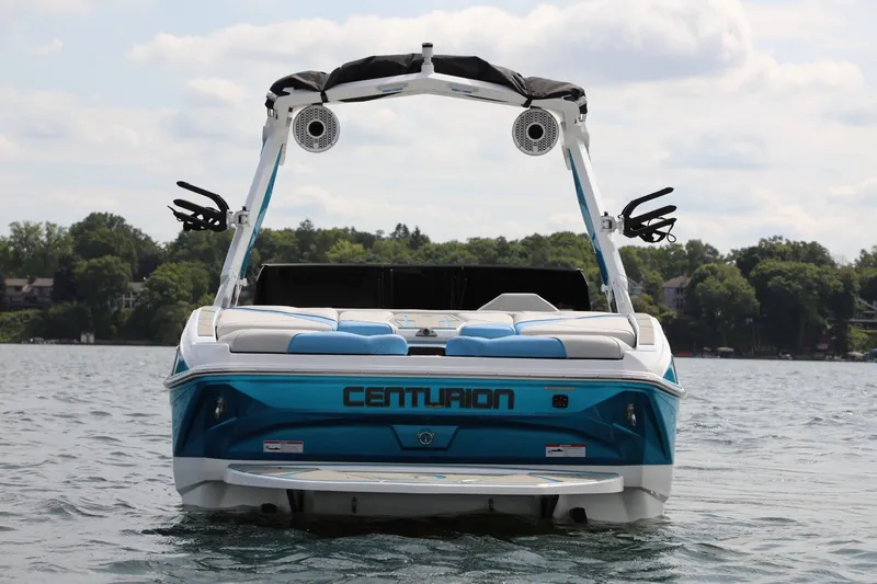 Slide: The Image of 2026 Centurion Nv233 boat on a lake, showcasing sleek design and modern features. - 3
